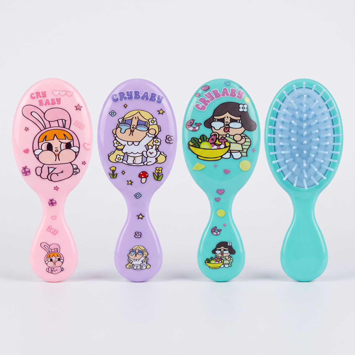 Cepillos de pelo mini con diseño Cry Baby en colores surtidos